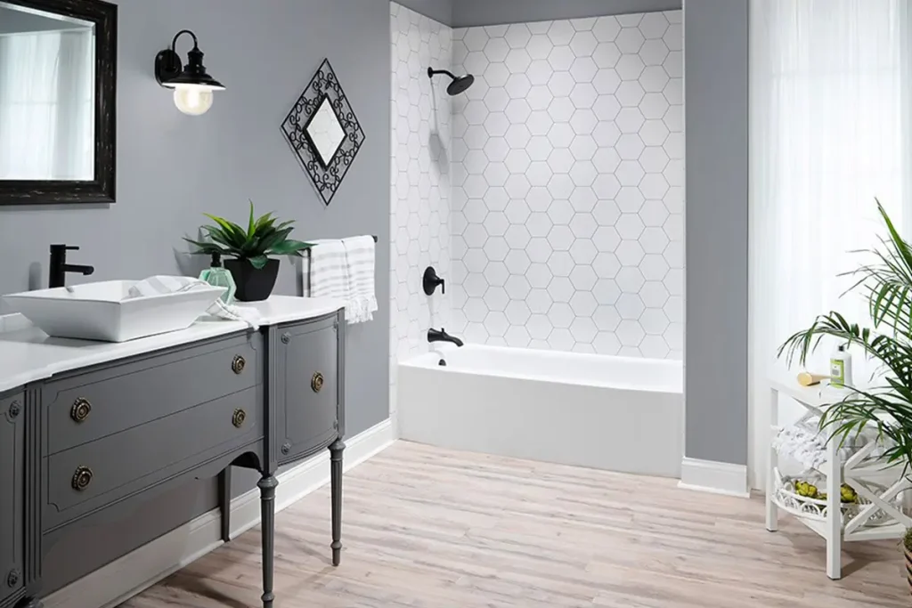 full bathroom remodel with dark grey vanity and light grey walls